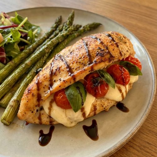 Caprese Stuffed Chicken A Simple Flavorful Weeknight Favorite. Close Up Plate Realistic Photo